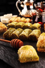 Middle eastern or arabic dishes. Turkish Dessert Baklava with pistachio on dishes