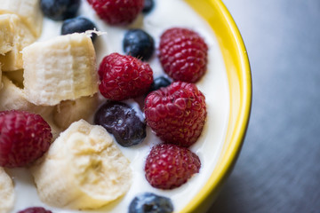 Morning breakfast set with bowl of fruits apples and blueberry.