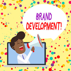 Conceptual hand writing showing Brand Development. Concept meaning Defining the product to excel in the market Promoting Man Speaking Through Laptop into Loudhailer Bubble Announce