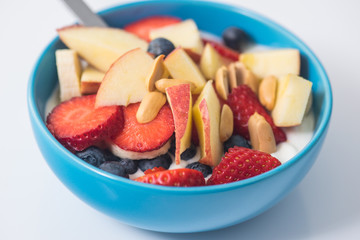 Morning breakfast set with bowl of fruits apples and blueberry.