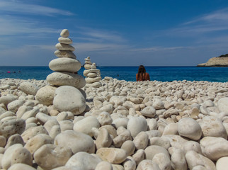 Fototapeta na wymiar Stones balanced on beach.