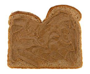 Wheat bread spread with almond and coconut butter isolated on a white background.