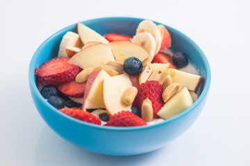 Morning breakfast set with bowl of fruits apples and blueberry.