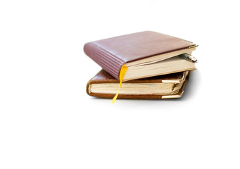 Two notebooks lying on a white background, free space for the title.