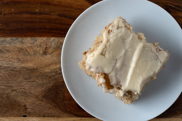 Serving of banana bread with icing on a plate