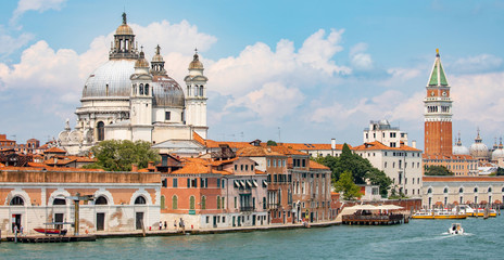 Fototapeta na wymiar Italy beauty, cathedral Santa Maria della Salute and bell tower of San Marco square in Venice, Venezia