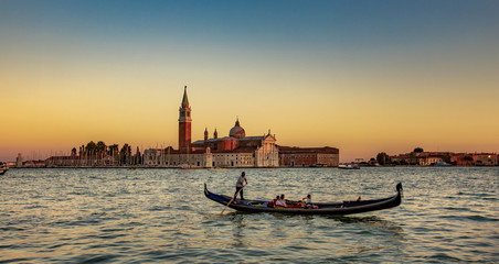 Italy beauty, sunset with gondola and San Giorgio Maggiore island in Venice, Venezia © radko68