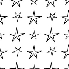 Seamless stars pattern. Hand drawn star doodles texture background.