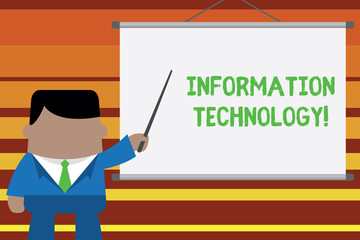 Word writing text Information Technology. Business photo showcasing use Systems to Store Retrieve Transmit Send Data Businessman standing in front projector screen pointing project idea