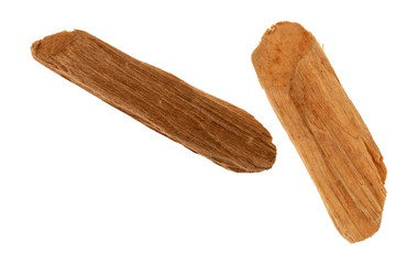 Two alder smoking chips for barbecuing on a white background