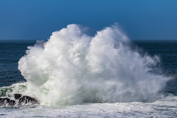 waves crashing on rocks