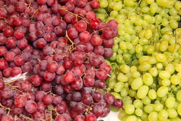 background of different grapes on market