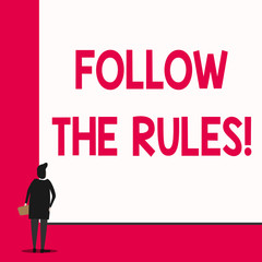 Conceptual hand writing showing Follow The Rules. Concept meaning go with regulations governing conduct or procedure Man stands in back view in front of huge big rectangle board