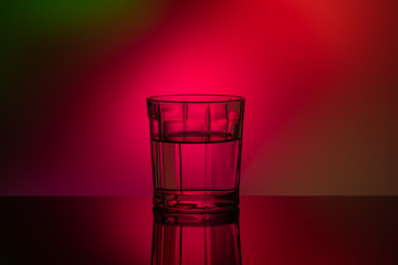 Silhouette of a glass Cup on a bright colored background