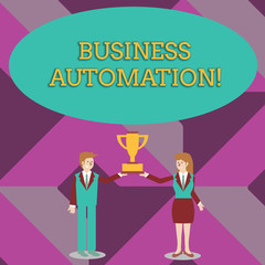 Writing note showing Business Automation. Business concept for for Digital Transformation Streamlined for Simplicity Man and Woman Business Suit Holding Championship Trophy Cup