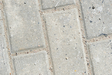 Obraz premium Gray paving slabs texture close up. Paving slabs background