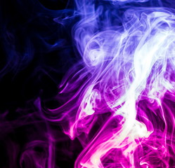 Obraz na płótnie Canvas Colored smoke on black background