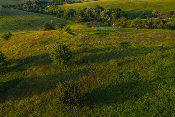 Obraz premium Hilly landscape on sunset time