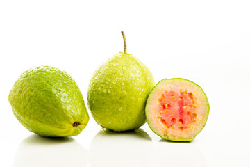 Red guava cut on white background.