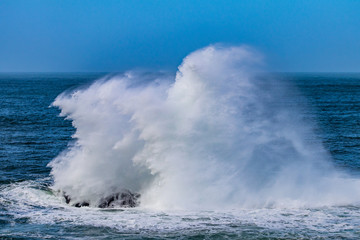 waves crashing on rocks