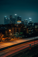 Fototapeta na wymiar Cityscape skyline view of downtown Los Angeles and 110 Freeway at night, in Los Angeles, California