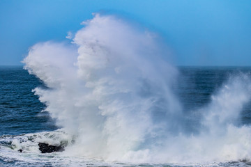 waves crashing on rocks