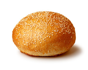 Hamburger bun with sesame  seeds. Fast food. Isolated on white background.