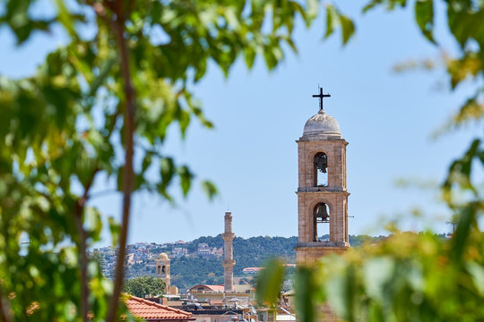                     Clocktower of cathedral against a clear blue sky in Hania, Crete, Creece.           