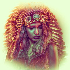 Colorful, beautiful girl with plume of american indian feathers