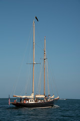 Fototapeta na wymiar Sail Boat motoring in the bay