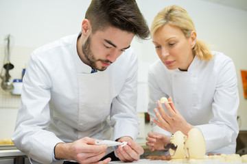 two chefs working with chocolate