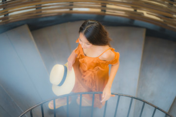 Fototapeta na wymiar Portrait beautiful young asian woman walk on circle stair