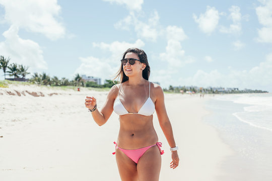 Pretty girl having fun on tropical beach