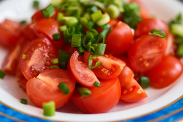 Chopped cherry tomatos and green onion salad, can be used as a backround