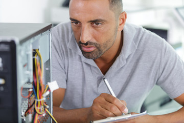 technician analysing a pc computer