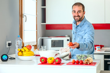  man holding fresh red tomato