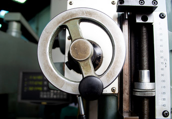 close up iron handle control of milling machine