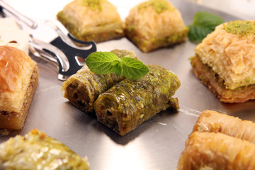 Middle eastern or arabic dishes. Turkish Dessert Baklava with pistachio on dishes