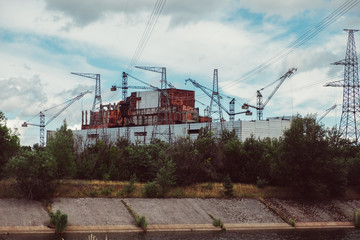 Chernobyl Nuclear Power Plant after atomic reactor explosion. Destroyed abandoned station and ghost...