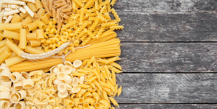 composition of raw pasta different shapes, frame of raw pasta. room for text 
