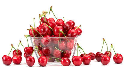 sweet cherries in a plate on a white background