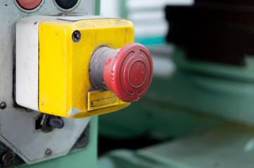 old red emergency button of machine