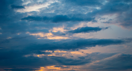 Naklejka na ściany i meble sunlight behind blue cloud at twilight time