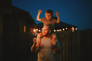 Happy Family doing sparkler fireworks together