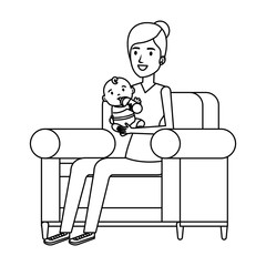 mother lifting little baby seated in sofa