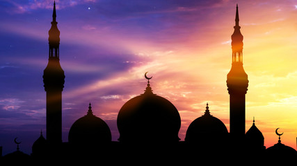 Fototapeta premium Mosque silhouette view . Generous Ramadan . An Islamic crescent on top of a mosque