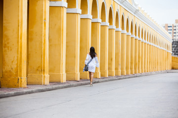 Beautiful woman walking around the walled city in Cartagena de Indias