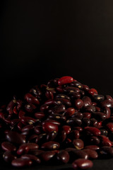 red beans in bulk on a black background