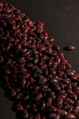 red beans in bulk on a black background