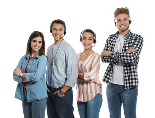 Fototapeta premium Technical support operators with headsets on white background